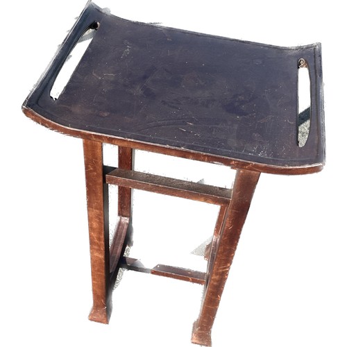 357 - Oriental leather topped table measures approximately 32 inches tall 22 inches wide 16 inches depth