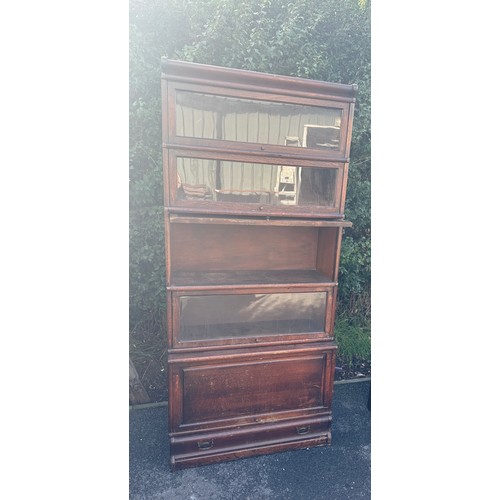 380 - Five stack oak glow worm bookcase measures approx 34 inches width by 74 inches tall and depth 15