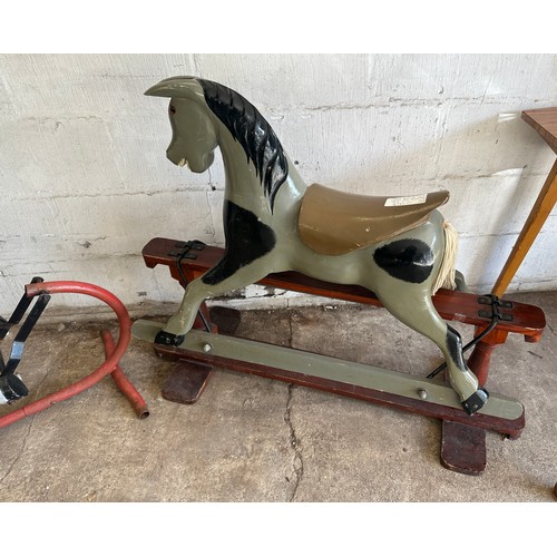 391 - Two vintage rocking horses largest measures approx 36 inches tall x 43 inches wide