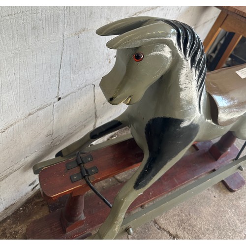 391 - Two vintage rocking horses largest measures approx 36 inches tall x 43 inches wide