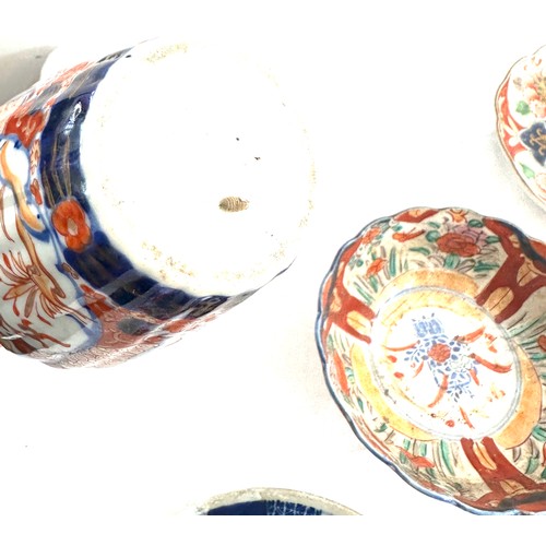 404 - Selection of oriental pottery includes 3 plates a vase and a bowl, marks to base