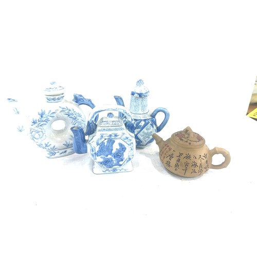 48 - Selection of 4 Oriental tea pots includes blue and white, marks to the base etc