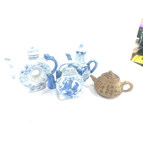 48 - Selection of 4 Oriental tea pots includes blue and white, marks to the base etc