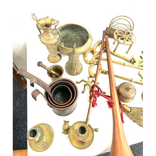 175 - Large selection of vintage and later brassware includes persian items, hunting horn, candle sticks e... 