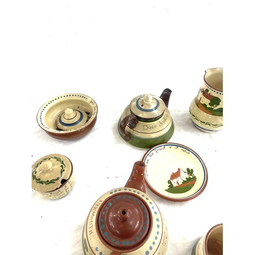 65 - Selection of Cornish ware pottery includes tea pots, bowls, milk jugs etc