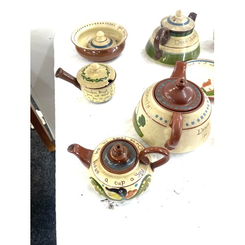 65 - Selection of Cornish ware pottery includes tea pots, bowls, milk jugs etc