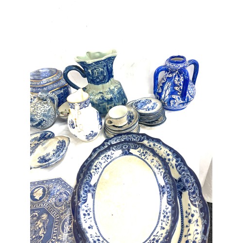 135 - Large selection of antique and later blue and white pottery