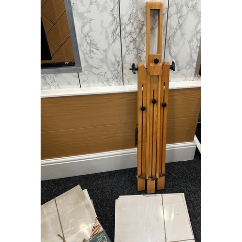 215 - Vintage artist easel and a selection of canvases