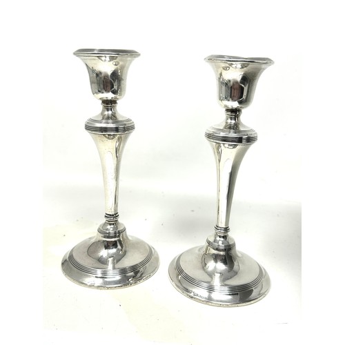 34 - Pair of silver hallmarked candlesticks filled bases