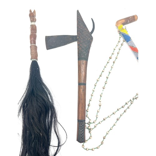 58 - Large selection of assorted african masks and a Lovers bow and arrow