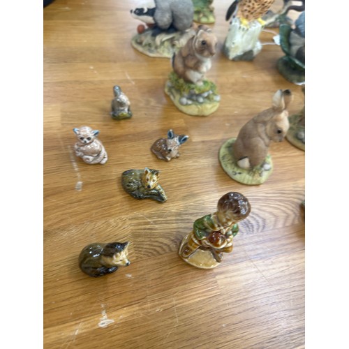 42 - Selection of assorted animal figures includes Wade, Beswick, Boarder fine art etc