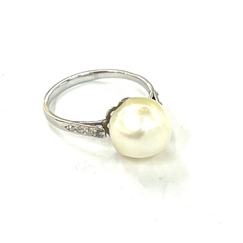 483 - Vintage unmarked platinum and diamond ring set with pearl, uk size J weight 2.7 grams