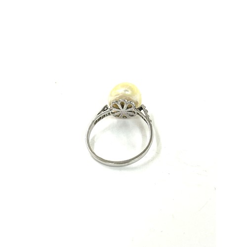 483 - Vintage unmarked platinum and diamond ring set with pearl, uk size J weight 2.7 grams