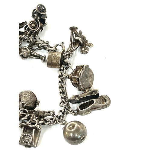 447 - Good silver charm bracelet 77 grams