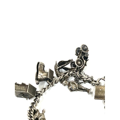 447 - Good silver charm bracelet 77 grams