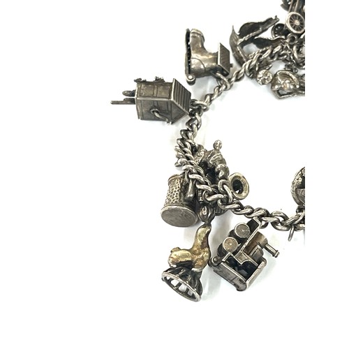 447 - Good silver charm bracelet 77 grams