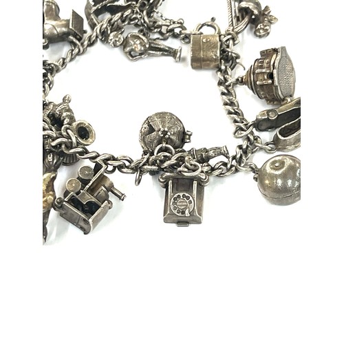 447 - Good silver charm bracelet 77 grams