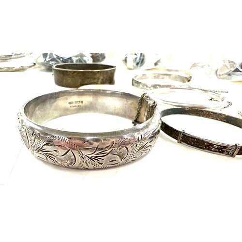 472 - 8 antique and vintage sterling silver bangles various makers and ages gross weight 96grams