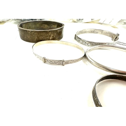 472 - 8 antique and vintage sterling silver bangles various makers and ages gross weight 96grams