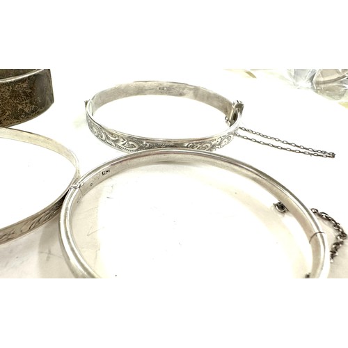 472 - 8 antique and vintage sterling silver bangles various makers and ages gross weight 96grams