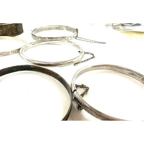 472 - 8 antique and vintage sterling silver bangles various makers and ages gross weight 96grams