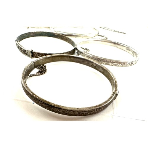 472 - 8 antique and vintage sterling silver bangles various makers and ages gross weight 96grams