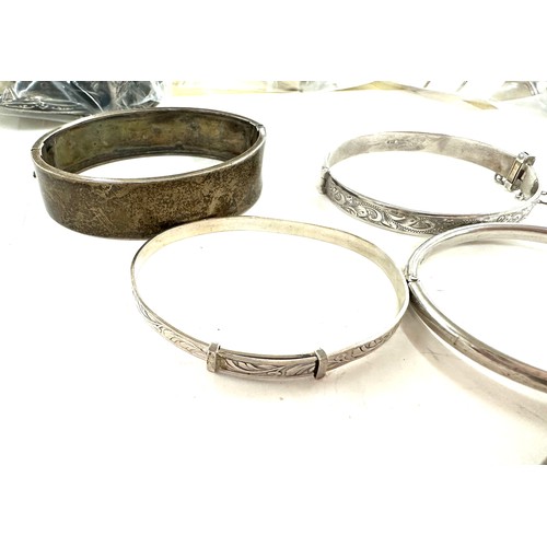 472 - 8 antique and vintage sterling silver bangles various makers and ages gross weight 96grams