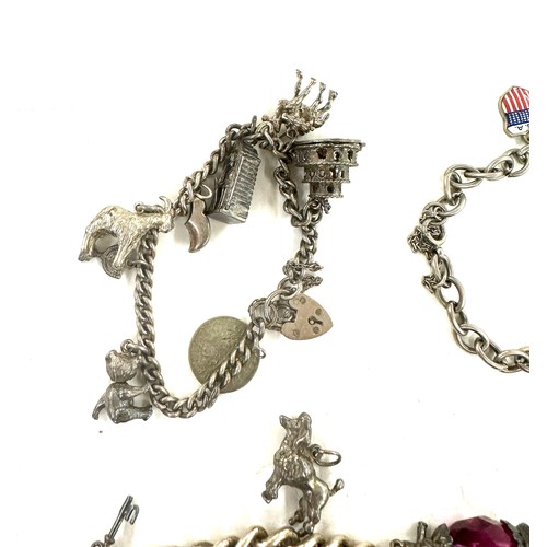 445 - Collection of vintage silver charm bracelets and loose charms gross weight 107grams