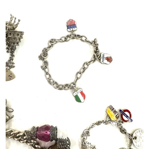 445 - Collection of vintage silver charm bracelets and loose charms gross weight 107grams