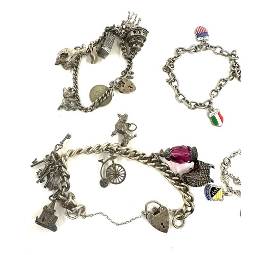 445 - Collection of vintage silver charm bracelets and loose charms gross weight 107grams