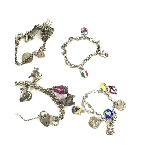 445 - Collection of vintage silver charm bracelets and loose charms gross weight 107grams