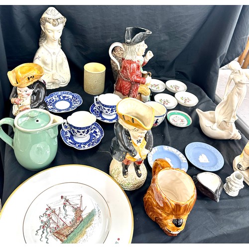 137 - Selection of assorted pottery includes toby jugs, past time figure etc