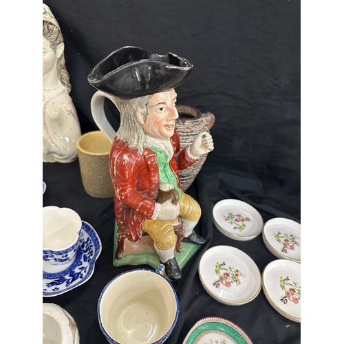 137 - Selection of assorted pottery includes toby jugs, past time figure etc