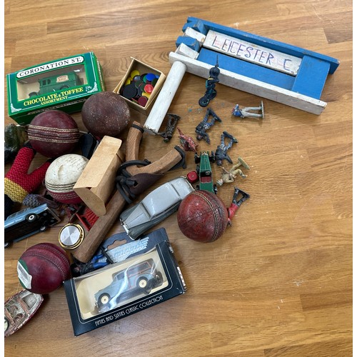 142 - Selection of collectable items includes cricket balls vintage cars, figures etc