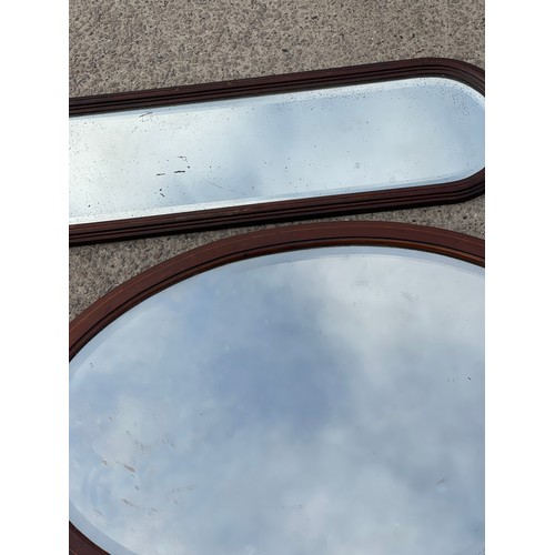 343 - 2 Oak framed mirrors largest measures approximately 31 inches wide 21 inches tall