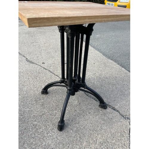 362 - Wrought iron base oak topped pub table 28 inches tall 24 inches square