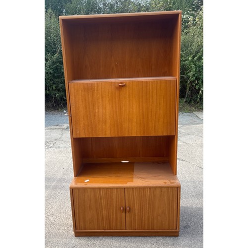 338 - Retro teak jasper 2 door 1 drop down cabinet measures approximately 71 inches tall 19.5 inches depth... 