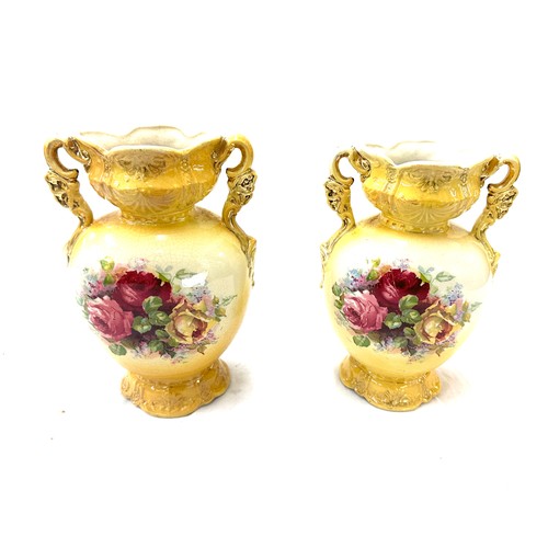 25 - Pair of vases measures approximately 10 inches tall