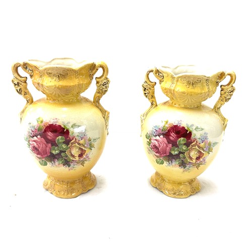 25 - Pair of vases measures approximately 10 inches tall