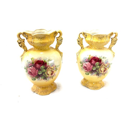 25 - Pair of vases measures approximately 10 inches tall