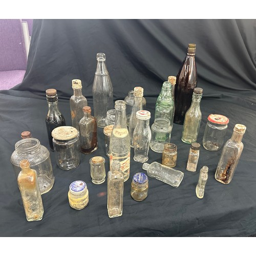 206 - Large selection of vintage and later glass bottles includes pepsi cola bottle, medicine bottles etc