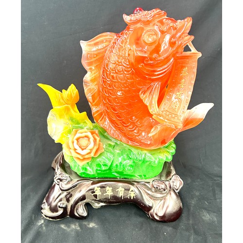 89 - Resin oriental fish figure measures approximately 15 inches tall