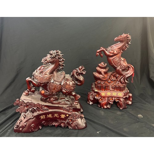 87 - 2 Oriental resin figures, largest measures approximately 18 inches tall