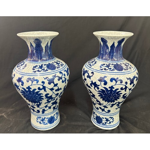 47 - Pair of blue and white oriental vases height approximately 12 inches