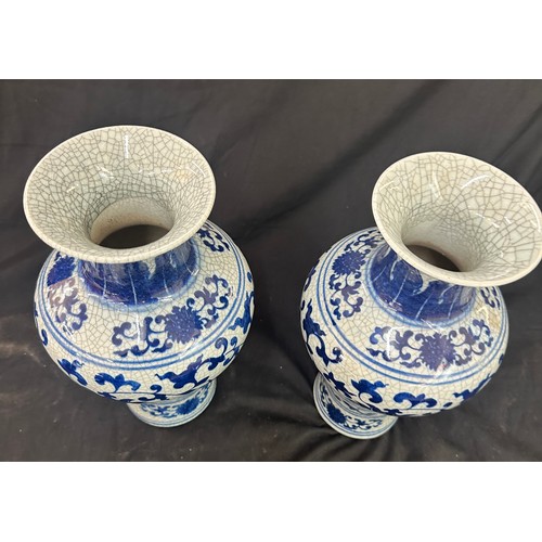 47 - Pair of blue and white oriental vases height approximately 12 inches