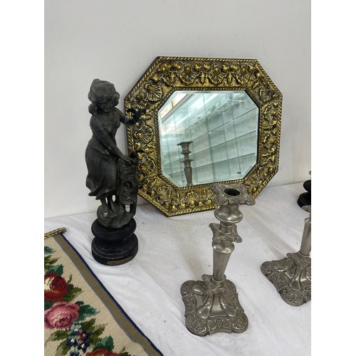 35 - Heavily embossed gilt mirror with bevelled glass, Pair Spelter figures a/f, pair silver plated candl... 