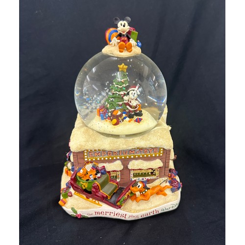 59 - Disney the Merriest place on earth snow globe, plays tune we wish you a merry Christmas, boxed