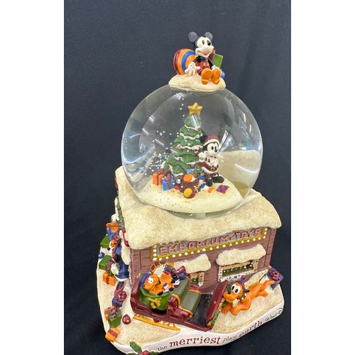 59 - Disney the Merriest place on earth snow globe, plays tune we wish you a merry Christmas, boxed