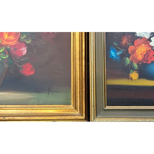 92 - Two gilt framed vintage signed paintings depicting floral arrangements largest measures approx 23 in... 