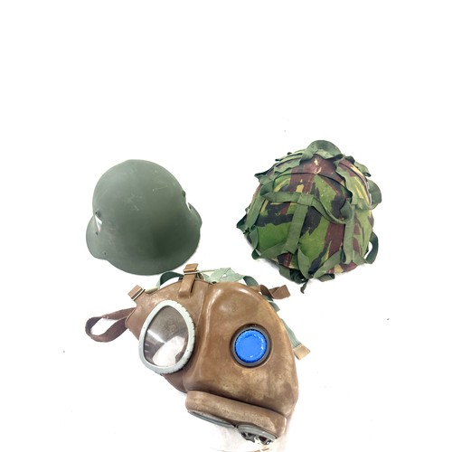 78 - 2 Vintage military helmets, 1 gas mask